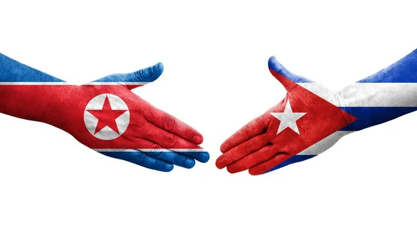 Uścisk Dłoni Między Kubą Koreą Północną Flagi Malowane Rękach Odizolowany — Zdjęcie stockowe