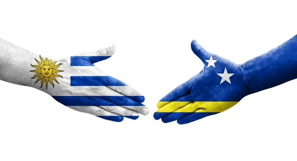 Händedruck Zwischen Curaçao Und Uruguay Flaggen Auf Händen Gemalt Isoliertes — Stockfoto
