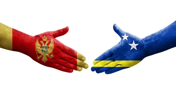 库拉索岛和黑山国旗之间的握手 孤立透明的图像 — 图库照片