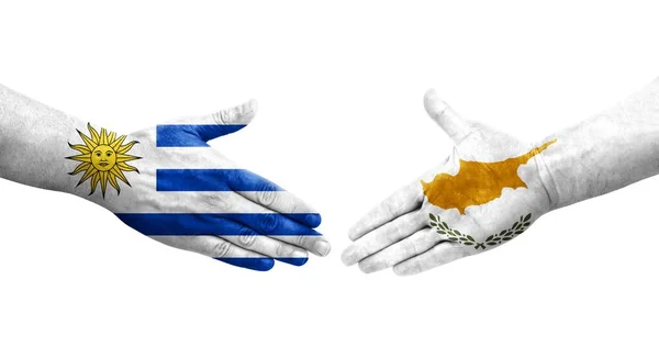 キプロスとウルグアイの旗の間の握手手で描かれ 隔離された透明画像 — ストック写真