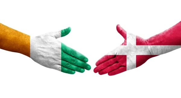丹麦和象牙海岸的国旗之间的握手 孤立透明的形象 — 图库照片
