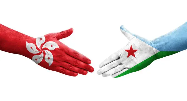 stock image Handshake between Djibouti and Hong Kong flags painted on hands, isolated transparent image.