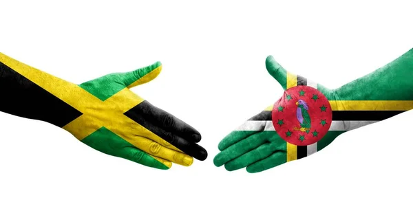 Händedruck Zwischen Dominica Und Jamaica Flaggen Auf Hände Gemalt Isoliertes — Stockfoto