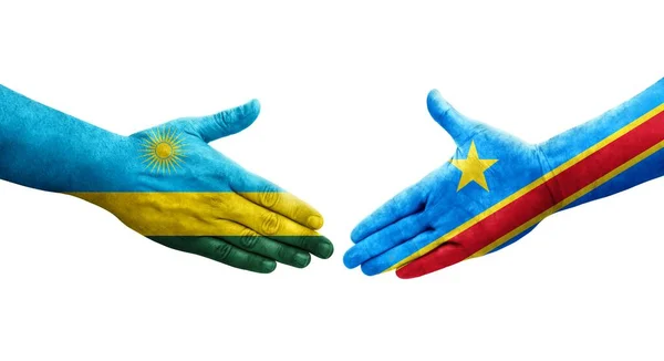 stock image Handshake between Dr Congo and Rwanda flags painted on hands, isolated transparent image.