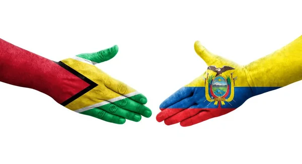 stock image Handshake between Ecuador and Guyana flags painted on hands, isolated transparent image.