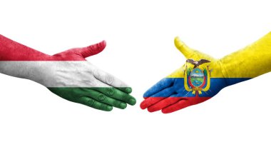 Ellere boyanmış Ekvador ve Macaristan bayrakları arasındaki el sıkışma, izole şeffaf görüntü.