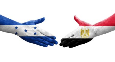 Mısır ve Honduras bayrakları arasında el sıkışma, izole şeffaf görüntü.