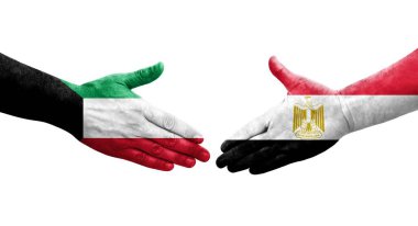 Mısır ve Kuveyt bayrakları arasındaki el sıkışma ellere boyanmış, izole şeffaf görüntü.