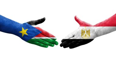 Mısır ve Güney Sudan bayrakları arasındaki el sıkışma ellerinde resmedilmiş şeffaf görüntü.