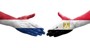 Mısır ve Hollanda bayrakları arasında el sıkışma, izole şeffaf görüntü.