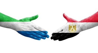 Mısır ve Sierra Leone bayrakları arasında el sıkışma..