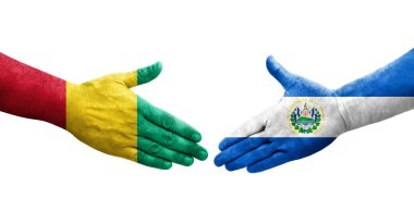 El Salvador ve Gine bayrakları arasındaki el sıkışma ellerinde izole şeffaf görüntü.