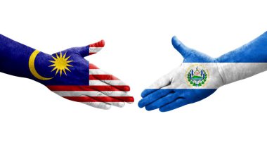El Salvador ve Malezya bayrakları arasındaki el sıkışma, izole şeffaf görüntü.
