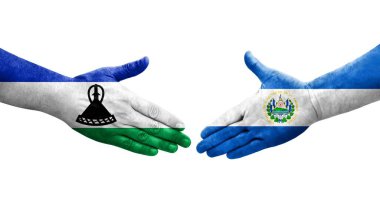 El Salvador ve Lesotho bayrakları arasındaki tokalaşma ellerinde izole şeffaf görüntü.