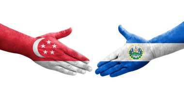 El Salvador ve Singapur bayrakları arasındaki tokalaşma ellerinde izole şeffaf görüntü.