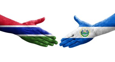 El Salvador ve Gambiya bayrakları arasında el sıkışma, izole şeffaf görüntü.
