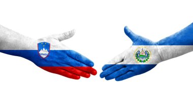 El Salvador ve Slovenya bayrakları arasındaki el sıkışma ellerinde resmedilmiş şeffaf görüntü.