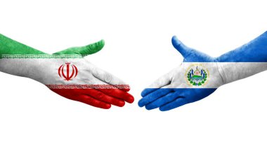 El Salvador ve İran bayrakları arasındaki el sıkışma, izole şeffaf görüntü.