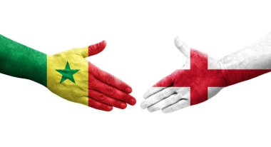 İngiltere ve Senegal bayrakları arasındaki el sıkışma, izole şeffaf görüntü.