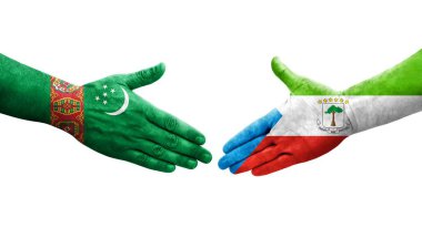 Ekvator Ginesi ile Türkmenistan bayrakları arasındaki el sıkışma, izole şeffaf görüntü.