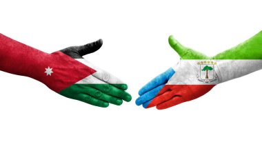 Ellere boyanmış Ekvator Ginesi ve Ürdün bayrakları arasındaki el sıkışma, izole şeffaf görüntü.