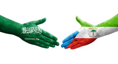 Ekvator Ginesi ile Suudi Arabistan bayrakları arasındaki el sıkışma, izole şeffaf görüntü.