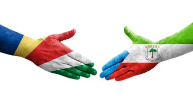 Ekvator Ginesi ve Seyşel bayrakları arasındaki el sıkışma, izole şeffaf görüntü.