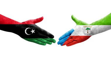 Ellerinde Ekvator Ginesi ve Libya bayrakları arasında el sıkışma, izole şeffaf görüntü.