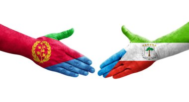 Ellere boyanmış Ekvator Ginesi ve Eritre bayrakları arasındaki el sıkışma, izole şeffaf görüntü.