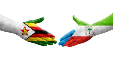 Ekvator Ginesi ile Zimbabwe bayrakları arasındaki el sıkışma, izole şeffaf görüntü.