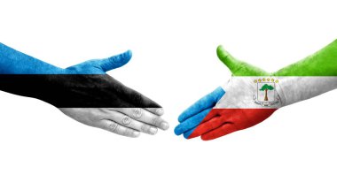 Ellerine boyanmış Ekvator Ginesi ve Estonya bayrakları arasındaki el sıkışma, izole şeffaf görüntü.