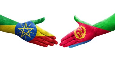 Eritre ve Etiyopya bayrakları arasındaki el sıkışma ellerinde izole şeffaf görüntü.