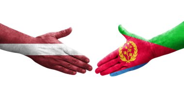 Eritre ve Letonya bayrakları arasındaki el sıkışma ellerinde resmedilmiş şeffaf görüntü.