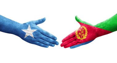 Eritre ve Somali bayrakları arasındaki el sıkışma ellerinde resmedilmiş şeffaf görüntü.