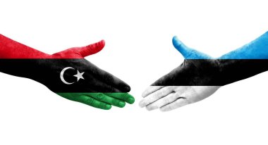 Ellerinde Estonya ve Libya bayrakları arasında el sıkışma, izole şeffaf görüntü.