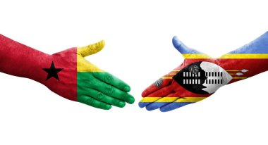 Eswatini ve Gine Bissau bayrakları arasındaki tokalaşma elleri boyalı, izole şeffaf görüntü.