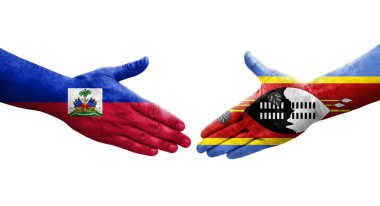 Ellerinde Eswatini ve Haiti bayrakları arasında el sıkışma, izole şeffaf görüntü.