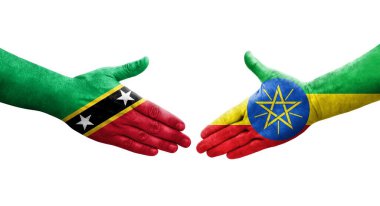 Etiyopya ve Saint Kitts ve Nevis bayrakları arasındaki el sıkışma, izole şeffaf görüntü.