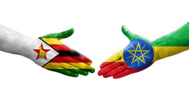 Etiyopya ve Zimbabwe bayrakları arasındaki el sıkışma ellerinde izole şeffaf görüntü.