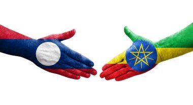 Etiyopya ve Laos bayrakları arasındaki tokalaşma elleri boyalı, izole şeffaf resim.