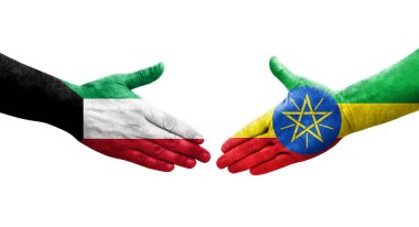 Etiyopya ve Kuveyt bayrakları arasındaki tokalaşma elleri boyalı, izole şeffaf resim.