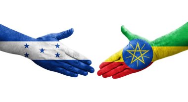 Etiyopya ve Honduras bayrakları arasında el sıkışma ellerinde izole şeffaf resim.