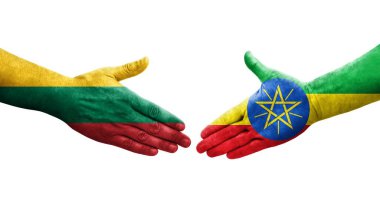 Etiyopya ve Litvanya bayrakları arasındaki el sıkışma ellerinde izole şeffaf görüntü.