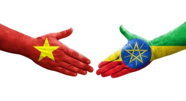 Etiyopya ve Vietnam bayrakları arasındaki el sıkışma ellerinde resmedilmiş şeffaf görüntü.