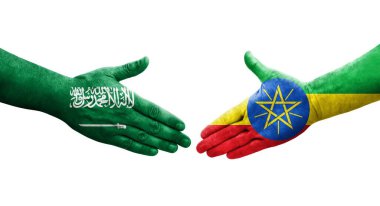 Etiyopya ve Suudi Arabistan bayrakları arasındaki el sıkışma, izole şeffaf görüntü.