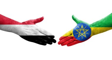 Etiyopya ve Yemen bayrakları arasındaki el sıkışma ellerinde izole şeffaf görüntü.