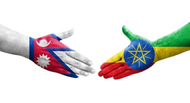 Etiyopya ve Nepal bayrakları arasındaki tokalaşma elleri boyalı, izole şeffaf görüntü.