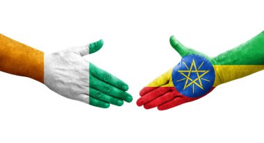 Etiyopya ve Fildişi Sahili bayrakları arasındaki el sıkışma, izole şeffaf görüntü.