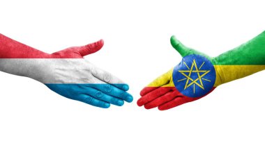 Etiyopya ve Lüksemburg bayrakları arasında el sıkışma, izole şeffaf görüntü.