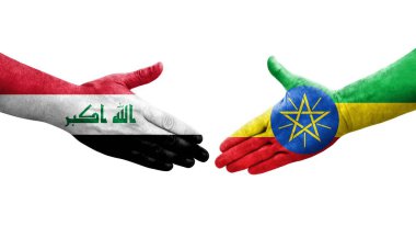 Etiyopya ve Irak bayrakları arasında el sıkışma, izole edilmiş şeffaf görüntü.